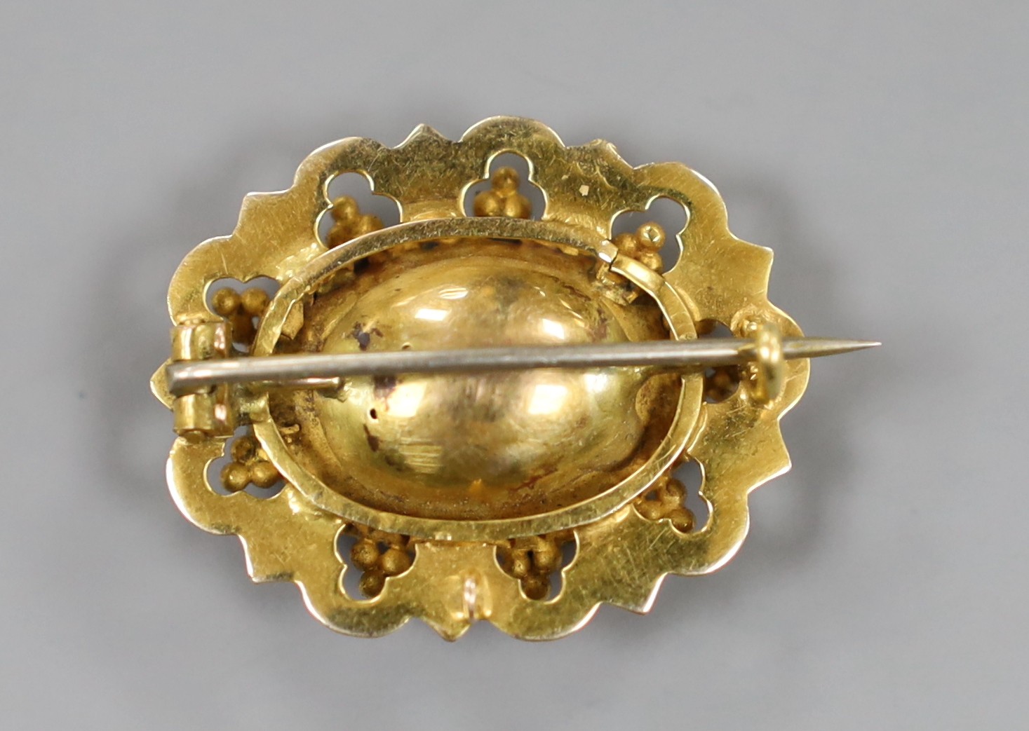 A yellow metal and foil backed amethyst? set oval brooch, 29mm, gross weight 7.5 grams.